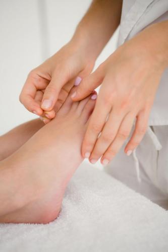 Close up view of woman holding a needle in an acupuncture therapy